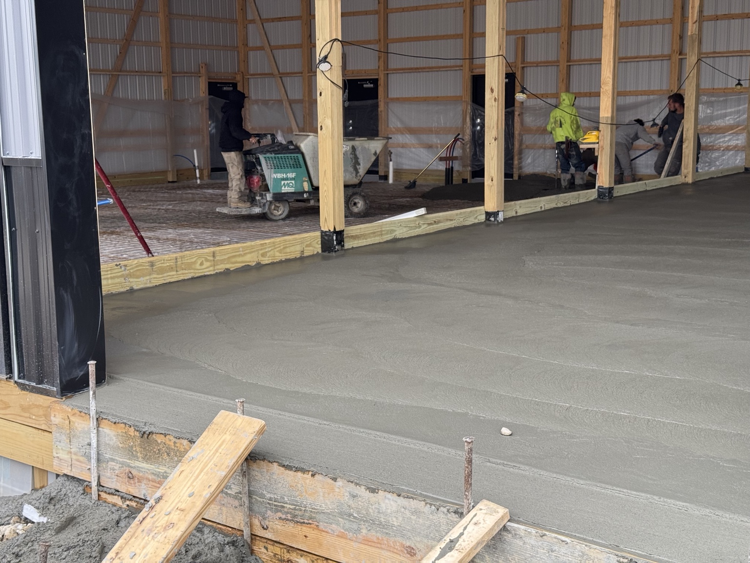 Concrete slab being poured inside PROFLEX commercial garage and flex building in Akron Ohio